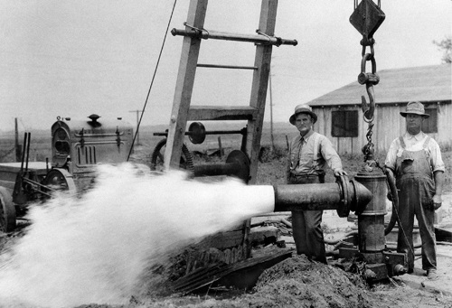 Flowing artesian well with well diggers