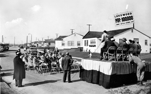 Spectators celebrate the completion of the Lakewood Mutual homes tract