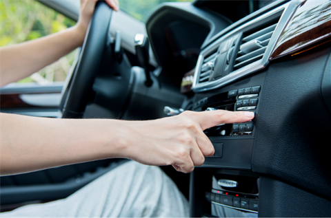 Person tuning to radio station