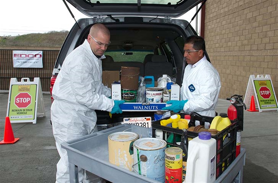 EDCO workers taking items from trunk