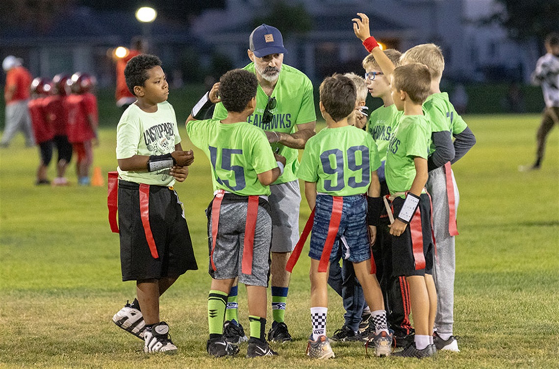 Flag football team with coach
