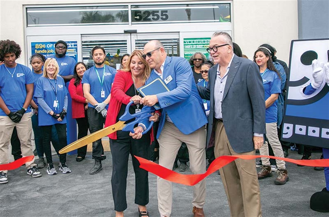 Goodwill managers cut ribbon at grand opening