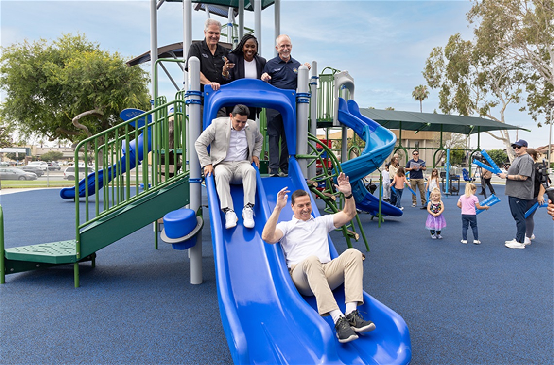 Council members on slide at new Bloomfield Park playground