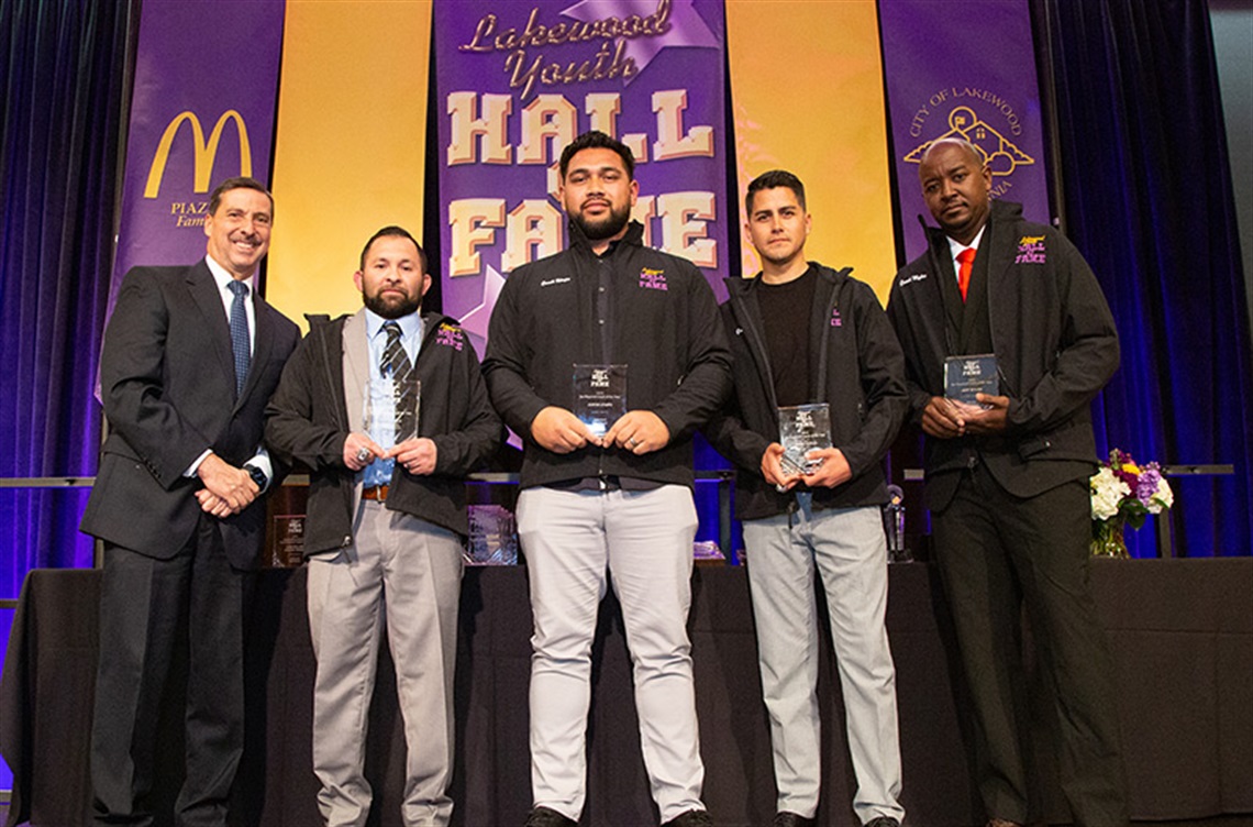 Four recipients of Coach of the Year with Council Member Todd Rogers