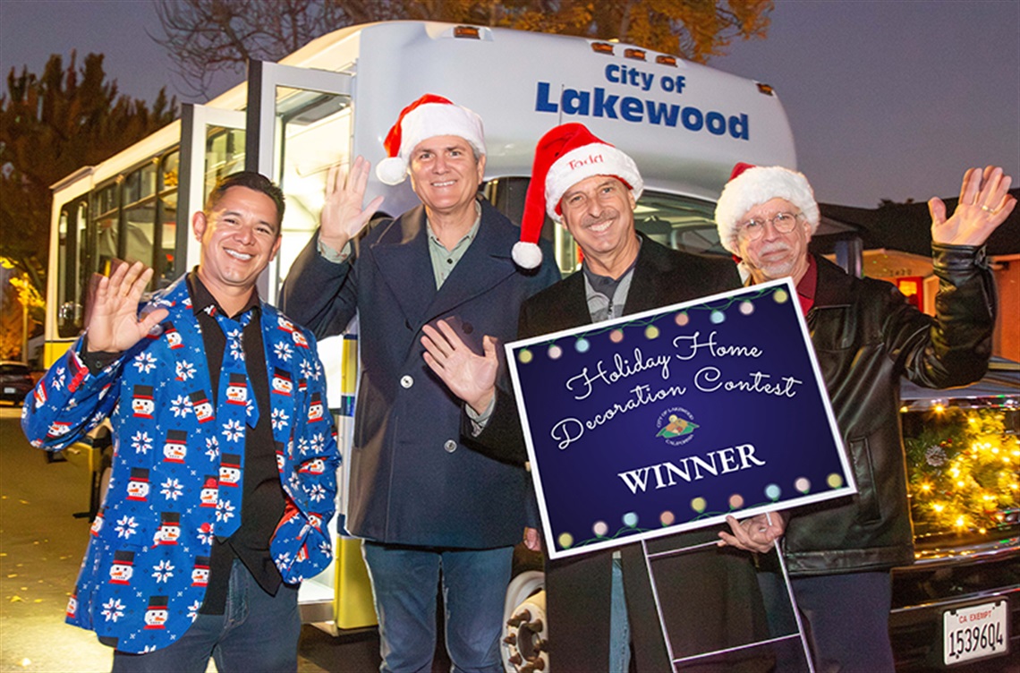 Council smiling with Home Decor Contest winner signs