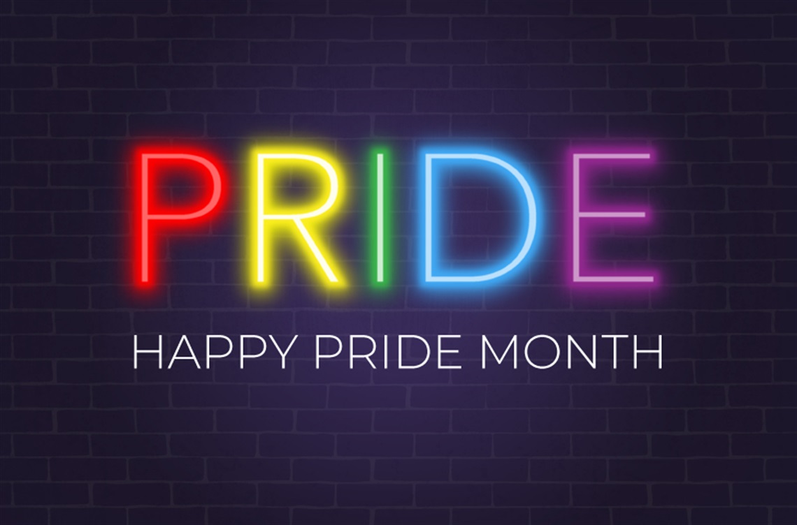 Black background with word PRIDE in rainbow colors