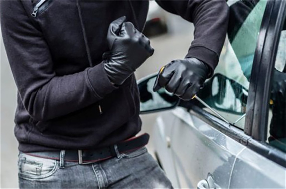 thief breaking into car